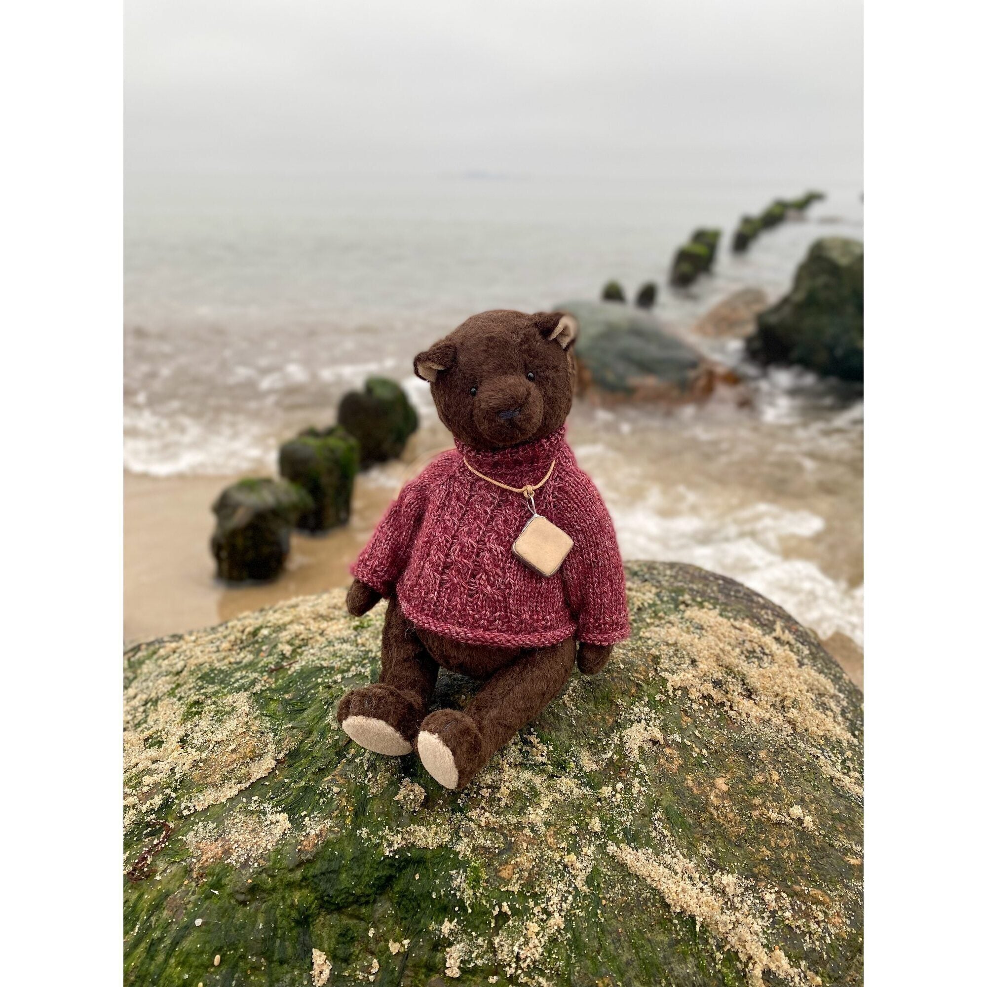 Teddy bear with ceramic pendant