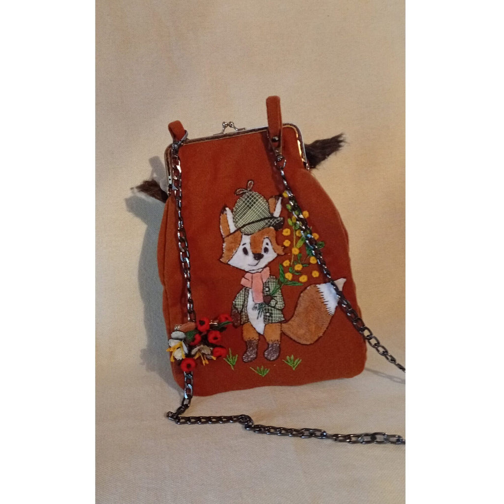 The fox bag,a handbag for a phone with mechanical music usin