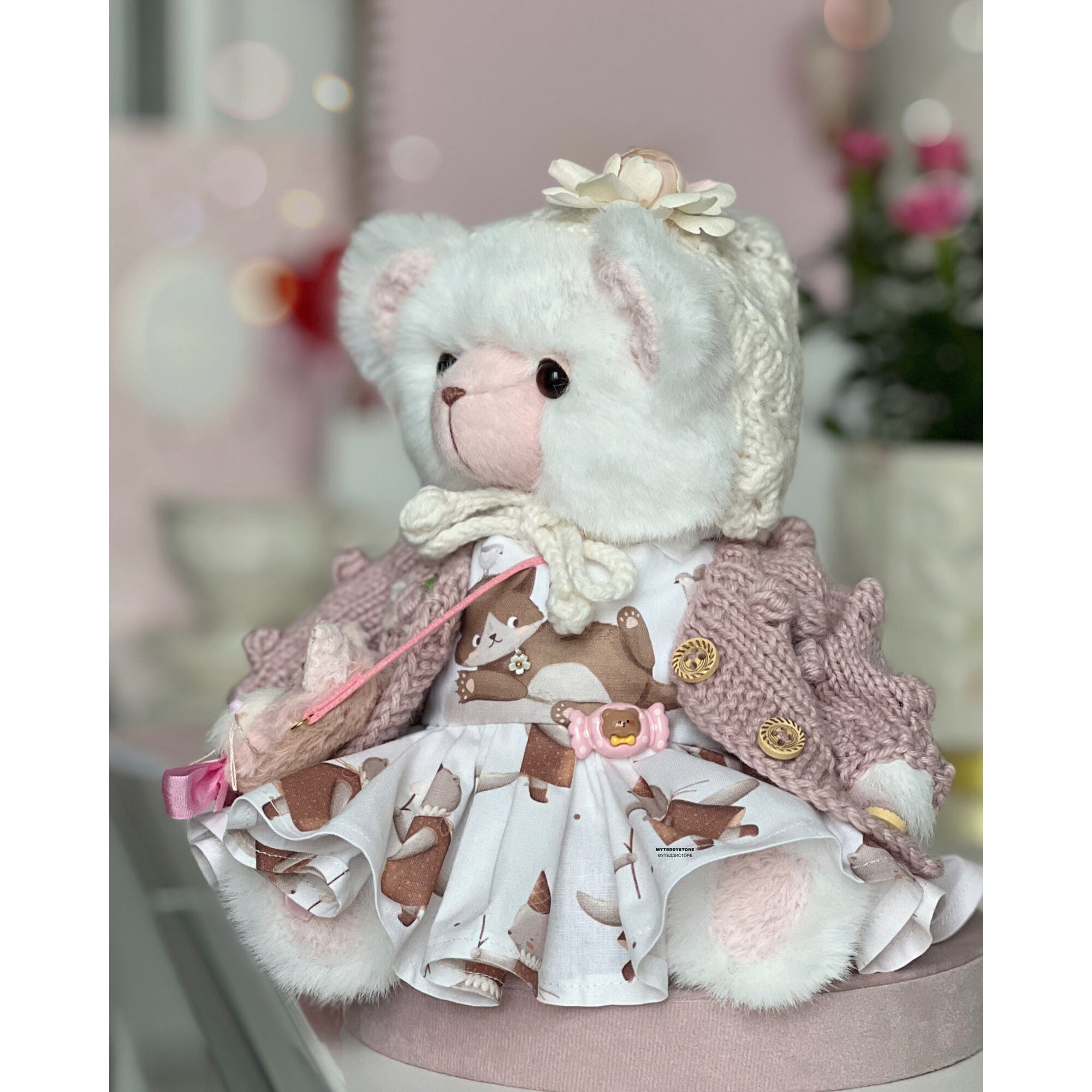 Teddy bear in a dress with cats