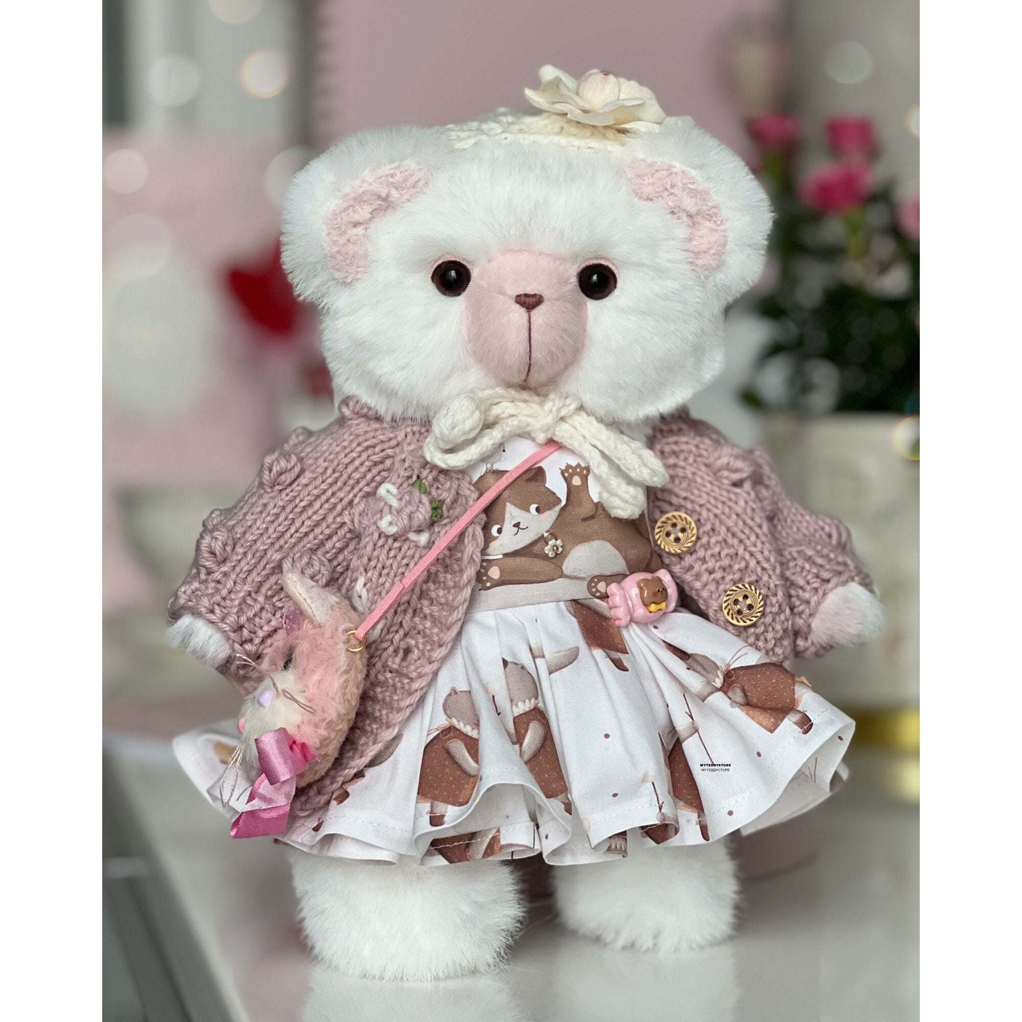 Teddy bear in a dress with cats